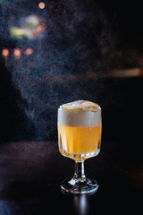 yellow coctail with spray