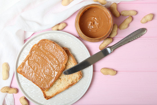 toast with peanut butter on the table.