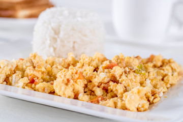 eggs with onion, tomato and rice (Colombian parrots)