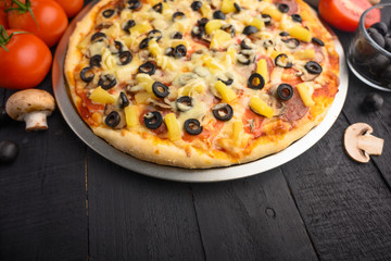 Italian pizza and ingredients. Pizzeria, restaurant, recipe book, home cooking. Horizontal photo with space for design.