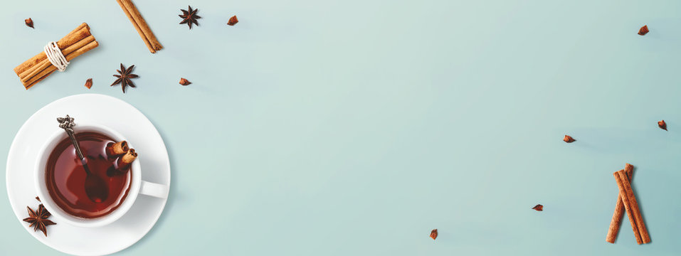 Black tea with cinnamon sticks and star anise - overhead view