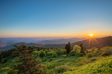 View of sunset from Cowee Mountain Overlook on Blue Ridge Parkway in summer.