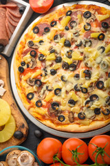 Italian pizza, with ingredients. Cookbook, homemade recipes, restaurant business. Vertical frame