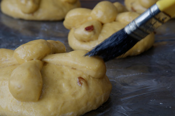 processing of puff pastry, pan de muerto, prepared in Mexico during the November celebration