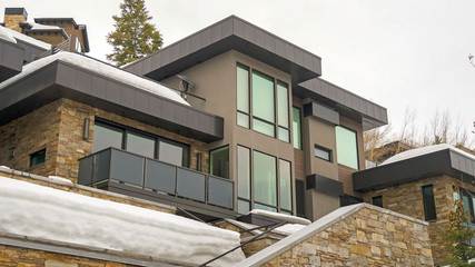 Panorama Home featuring a modern architectural design viewed against white sky in winter