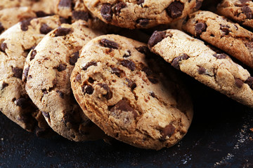 Chocolate cookies on wooden table. Chocolate chip cookies shot on table