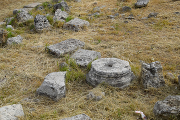 Fragments of ancient buildings, ruins of the ancient city of Hierapolis. Stone blocks with traces...