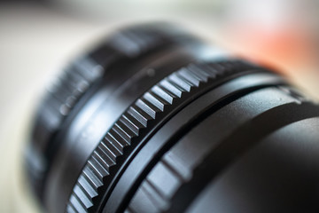 Old vintage manual photo lens with adapter for modern mirrorless camera