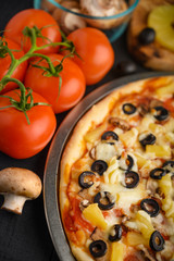 half Italian pizza, with ingredients. Cookbook, homemade recipes, restaurant business. Vertical shot