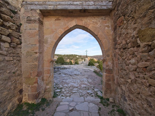 Fototapeta na wymiar Stone arch overlooking the cross