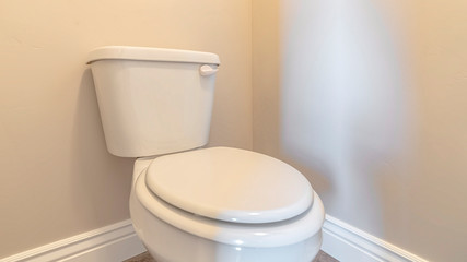 Fototapeta na wymiar Panorama frame White toilet and cistern in a bathroom