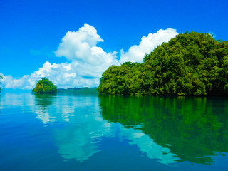 Obraz na płótnie Canvas Blue sky and green Rock Islands view from ocean, Airai state, Palau, Pacific 