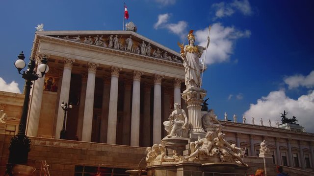 The Parliament building on Vienna's Ringstrasse boulevard, sunny day, time lapse,