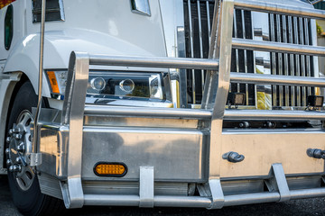 Protection powerful aluminum grille guard combined with bumper on big rig semi truck with chrome accessories