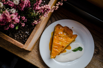 Slice of fall pumpkin pie with cream