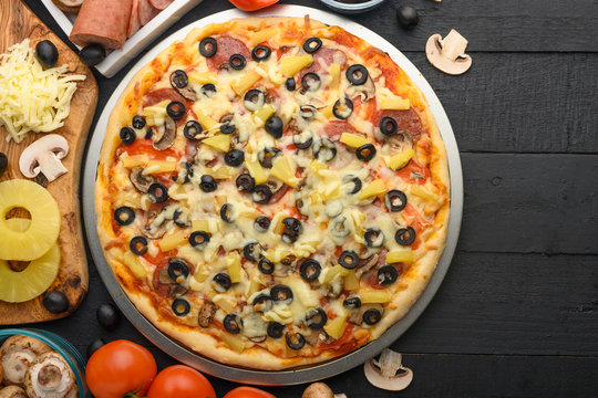 Italian pizza and ingredients. Pizzeria, restaurant, recipe book, home cooking. Horizontal photo with space for design.