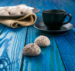 cup of coffee and cookies on wooden table