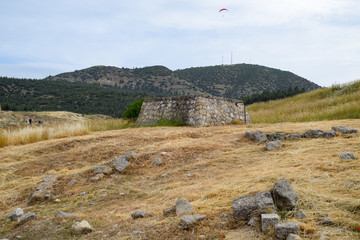 remains of ancient antique buildings of Hierapolis from limestone blocks, dilapidated walls.