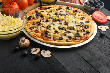 Italian pizza and ingredients. Pizzeria, restaurant, recipe book, home cooking. Horizontal photo with space for design.