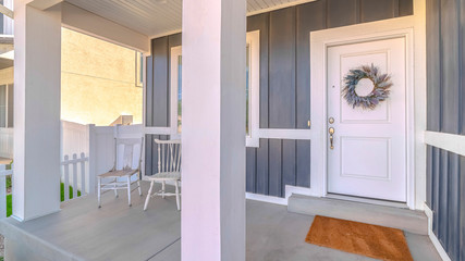 Panorama frame Front door and porch area of modern suburban home