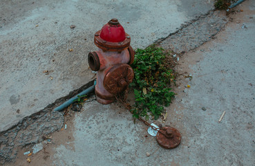 Old red Fire Hydrant on the street in Vietnam