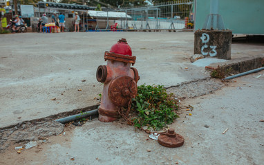 Old red Fire Hydrant on the street in Vietnam