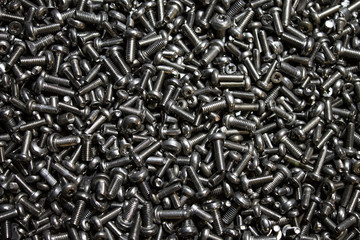 Texture of scattered bolts on the table.