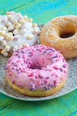 Sweet colorful dessert. Donut with a hole and pink delicious icing.