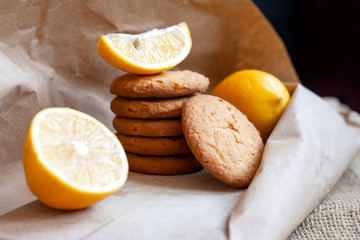 lemon cookies made at home, citrus baking deliciously lies on a table in a paper wrapper, a recipe for fruit baking