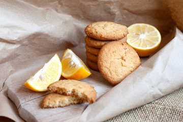 lemon cookies made at home, citrus baking deliciously lies on a table in a paper wrapper, a recipe for fruit baking