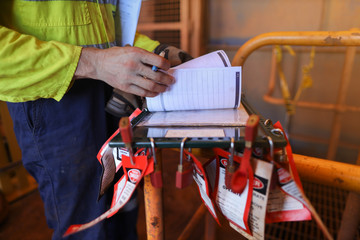 Personnel red locks attached with danger tag together with safety isolation permit lock box...