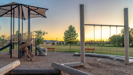 Panorama frame Neighborhood park with fun playground featuring slides and swings for children