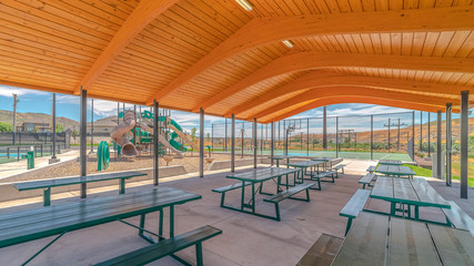 Fototapeta na wymiar Panorama frame Outdoor shelter area in recreational fun park