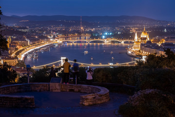 Naklejka premium A breathtaking night time view looking down on Budapest along the Danube River 