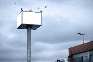 Big white advertising sign close-up.