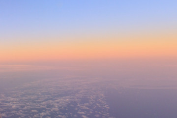 Sky - OCTOBER 16, 2019:  Landscape sunrise view with clouds from airplane window seat