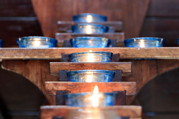 Obraz na płótnie Canvas Naju-si, Jeollanam-do / South Korea - OCTOBER 16, 2019: Candles in a Catholic Church in the shape of a cross