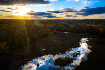 Fototapeta na wymiar Aerial of Sunset with Fall Foliage