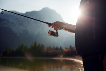 Fishing on the lake at sunset time
