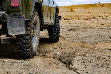 Autotravel. Jeep on the mountain roads. Mountains, stone desert. © YUABOG