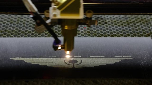 CNC engraving. Laser engraver with cnc, logo engraving laser. Laser engraving on metal