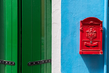 Windows of Venice, Murano and Burano. Picturesque windows with shutters on the famous island Burano. Decorated window on colorful wall in Burano island, Venice, Italy