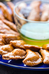 oriental katayef dessert filled with walnuts and cinnamon glazed with honey