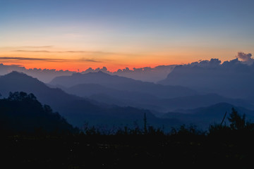 Sunset or sunrise mountain peaks colorful sky