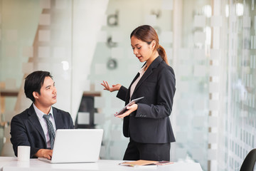 Startup business concept, Young businesswoman present in meeting room with tablet computer.