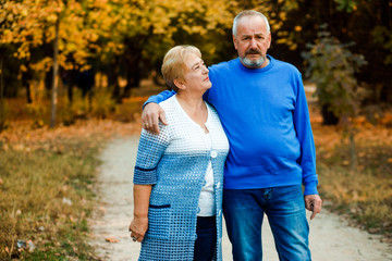 Pensioners walk in the park. Happy old age.