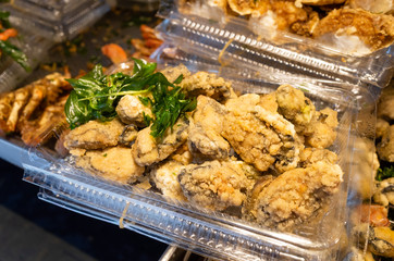 taiwanese fried chicken on a plate in the street