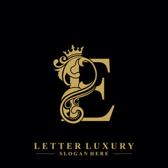 Initial letter E luxury beauty flourishes ornament with crown logo template.