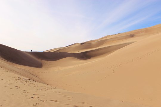 Sand dunes in desert © Tonya Hance