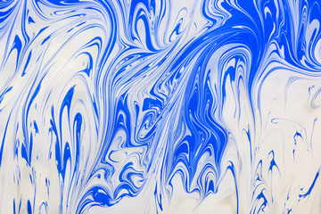 Abstract painting technique Ebru .Turkish style Ebru on the water with acrylic paints press waves.Modern art marble liquid texture